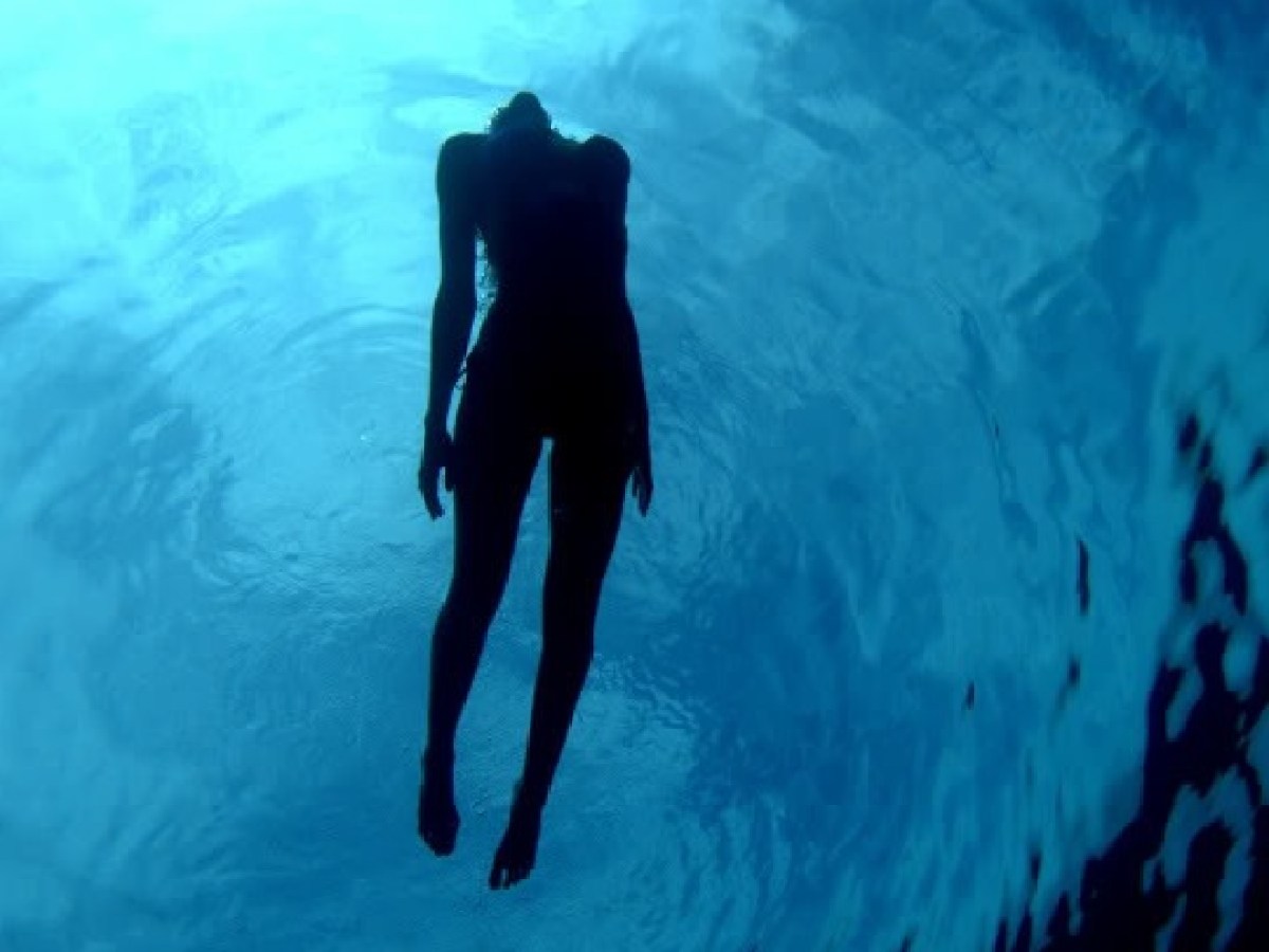 a man riding a wave on a surfboard in the water